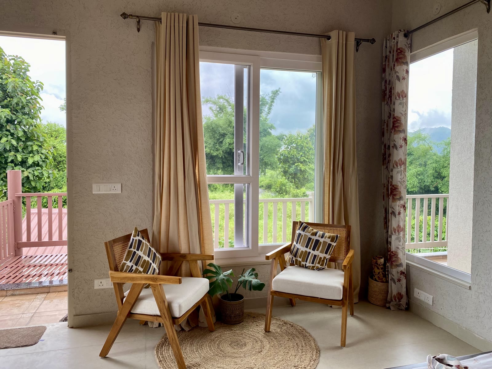 A quiet sitting corner beside the bedroom windows